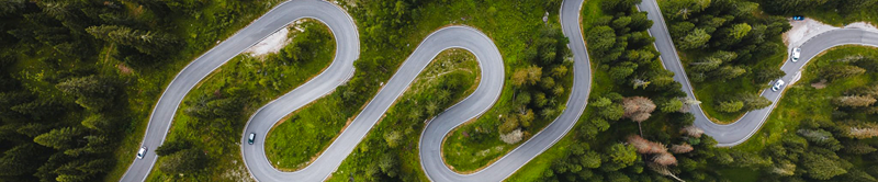 Aerial view of windy road in a forest